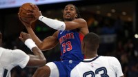 Detroit Pistons guard Jaden Ivey (23) drives to the basket as Memphis Grizzlies forward Cedric Coward (23) defends during the second quarter at FedExForum.