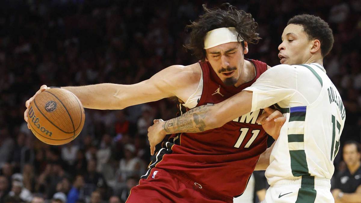 Milwaukee Bucks guard Ryan Rollins (13) defends Miami Heat forward Jaime Jaquez Jr. (11) during the second half of an NBA Cup game at Kaseya Center.