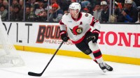 Ottawa Senators defenseman Jake Sanderson (85) skates with the puck against the Anaheim Ducks in the second period at Honda Center.