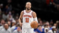 New York Knicks guard Jalen Brunson (11) brings the ball up court against the Dallas Mavericks during the second half at the American Airlines Center.