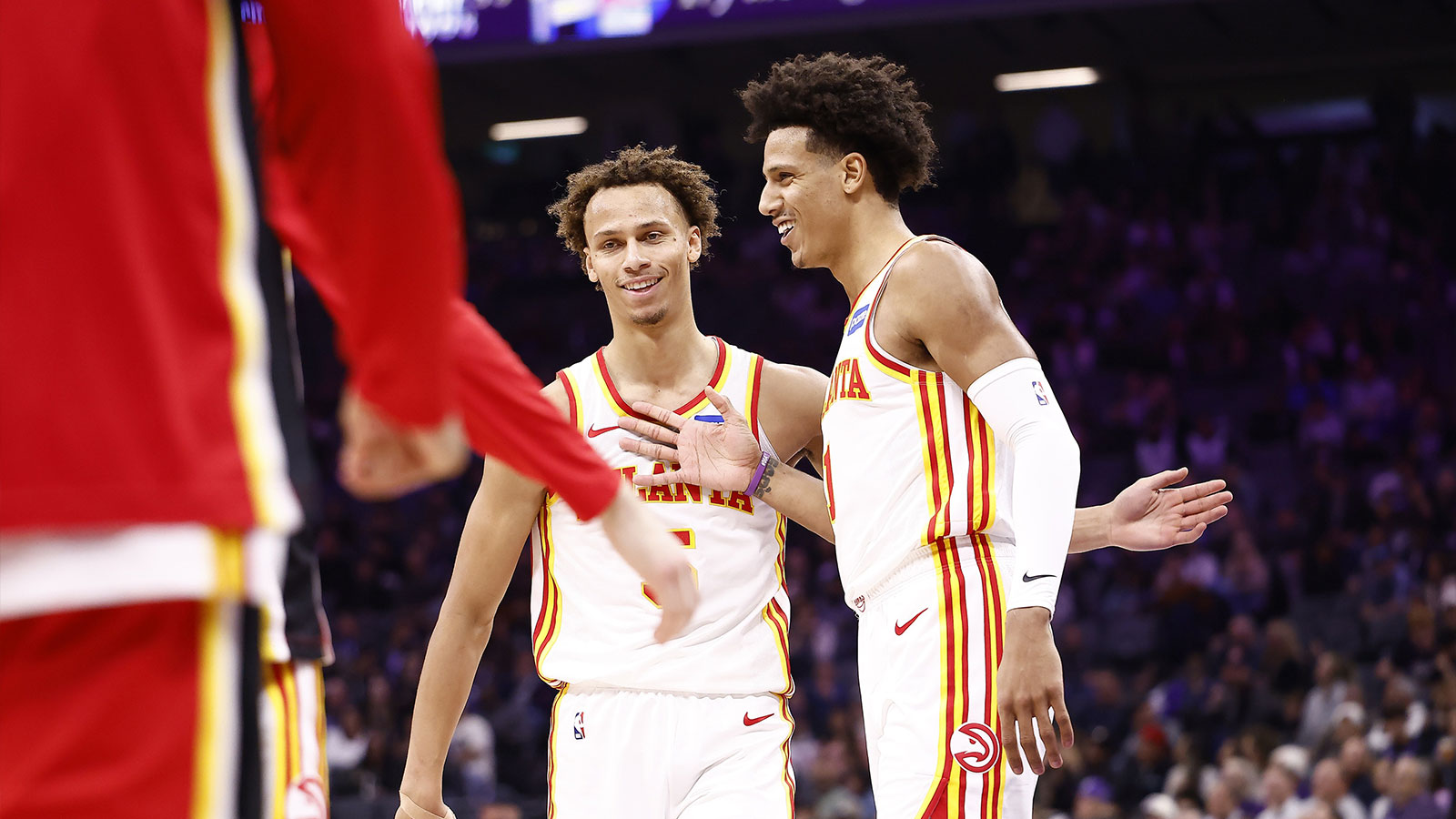 Atlanta Hawks guard Dyson Daniels (5) celebrates with forward Jalen Johnson (1) as a time out is called against the Sacramento Kings during the second quarter at Golden 1 Center. 