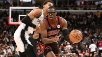 Nov 10, 2025; Chicago, Illinois, USA; Chicago Bulls forward Jalen Smith (25) moves the ball against San Antonio Spurs forward Victor Wembanyama (1) during the first half at United Center. Mandatory Credit: Matt Marton-Imagn Images