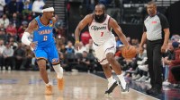 LA Clippers guard James Harden (1) dribbles the ball against Oklahoma City Thunder guard Shai Gilgeous-Alexander (2) in the first half at Intuit Dome.