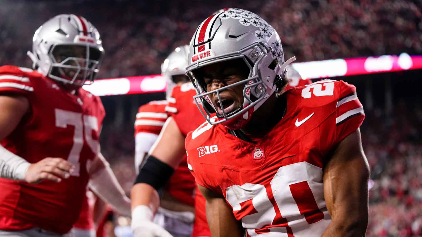 Ohio State Buckeyes running back James Peoples (20) celebrates a touchdown run during the NCAA football game against the UCLA Bruins at Ohio Stadium in Columbus on Nov. 15, 2025.
