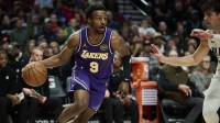 Los Angeles Lakers guard Bronny James (9) drives to the basket during the second half against Portland Trail Blazers forward Deni Avdija (8) at Moda Center.