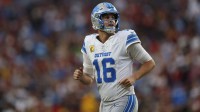 Detroit Lions quarterback Jared Goff (16) runs downfield during the first quarter against the Washington Commanders at Northwest Stadium.