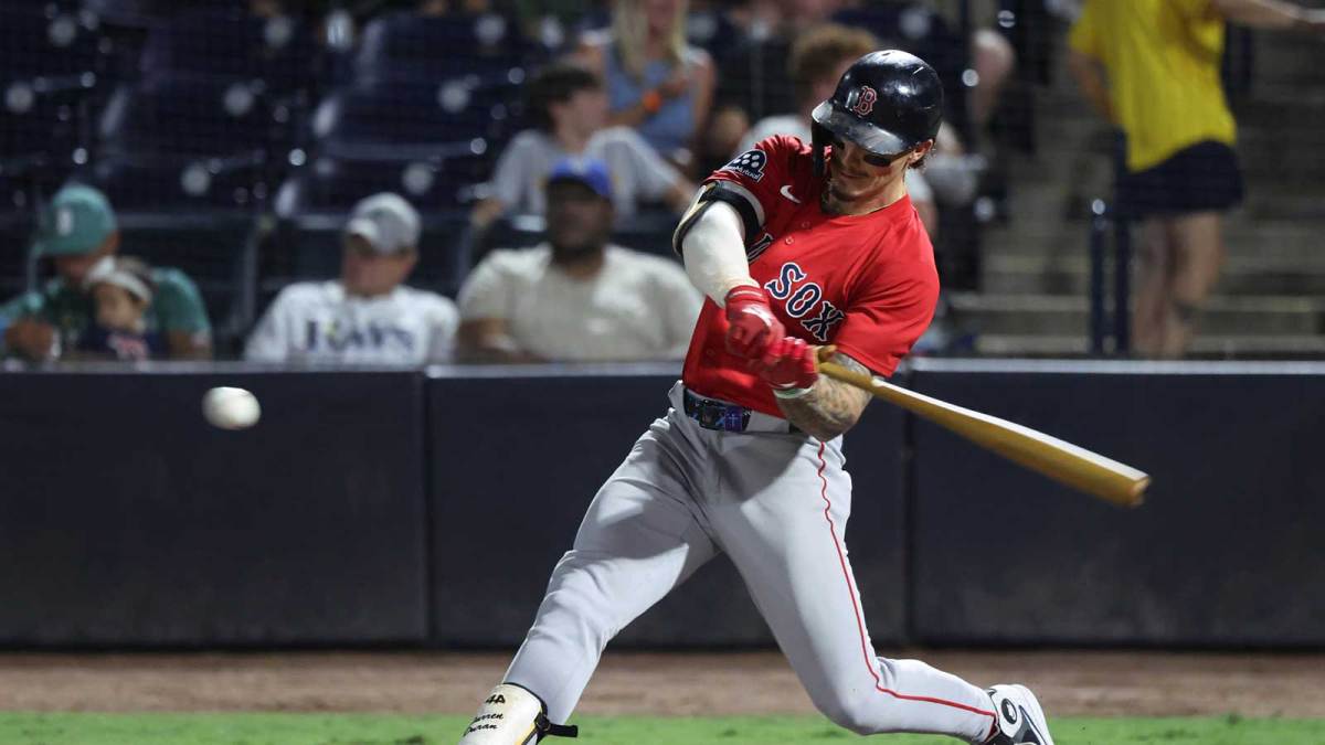 Boston Red Sox outfielder Jarren Duran (16) hits a two-run home run during the seventh inning against the Tampa Bay Rays at George M. Steinbrenner Field.
