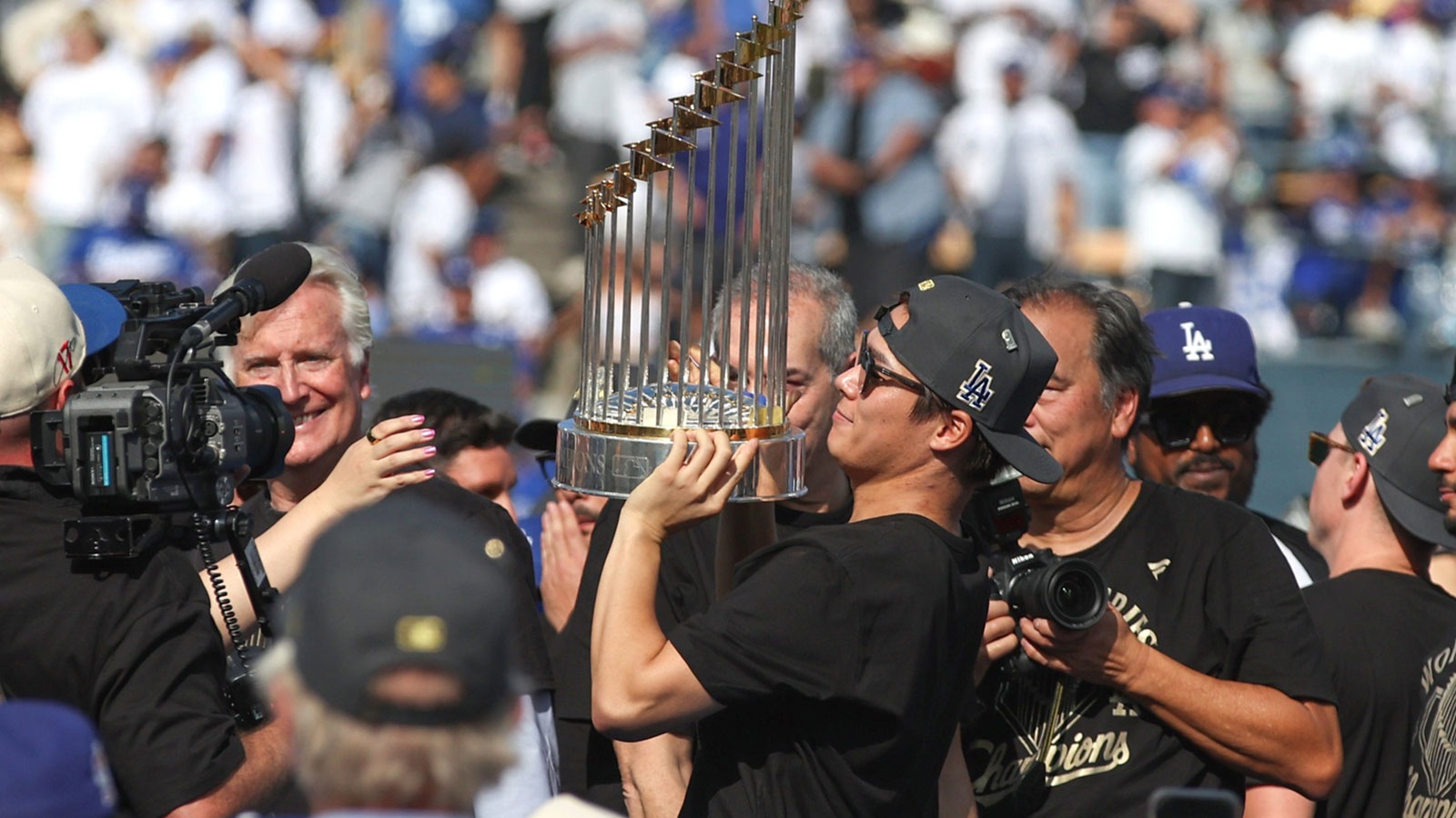 2025 World Series MVP Yoshinobu Yamamoto holds up the 2025 World Series Championship trophy durng the celebration that was held at Dodger Stadium on Monday November 3, 2025. Dodgers beat the Toronto Blue Jays in a thrilling game 7 that was played in Toronto Canada to take the Championship.