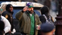 Jason Kelce waves to fans during the Super Bowl LIX championship parade and rally.