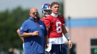 New York Giants head coach Brian Daboll and quarterback Jaxson Dart (6) during training camp at Quest Diagnostics Training Center.