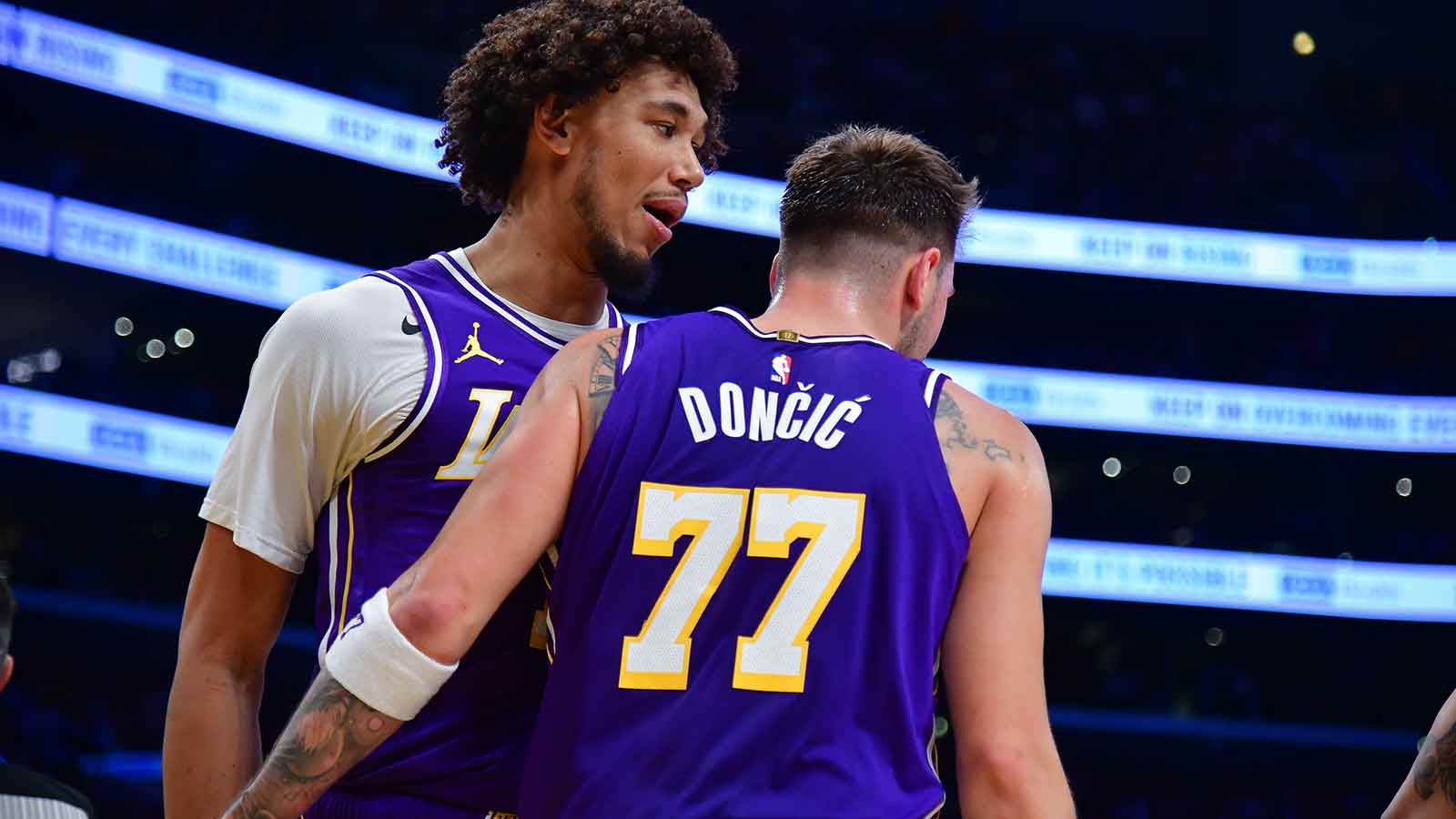 Los Angeles Lakers center Jaxson Hayes (11) meets with Los Angeles Lakers guard Luka Doncic (77) after a basket scored against the San Antonio Spurs during the first half at Crypto.com Arena.