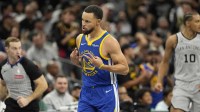 Golden State Warriors guard Stephen Curry (30) reacts after scoring a three-point basket during the second half against the San Antonio Spurs at Frost Bank Center.