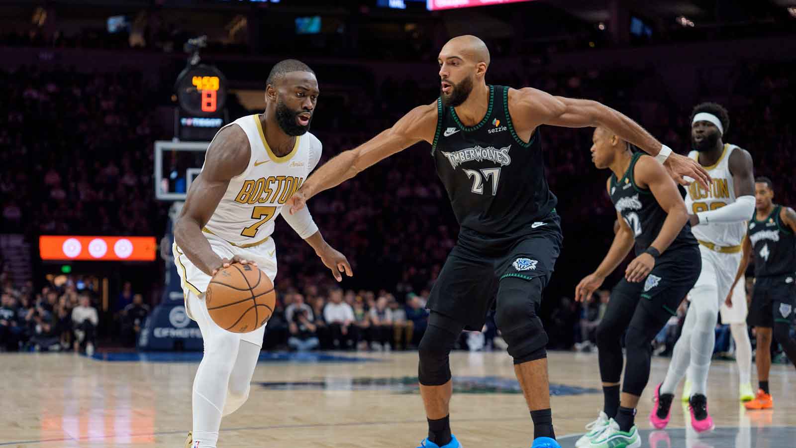 Boston Celtics guard Jaylen Brown (7) dribbles past Minnesota Timberwolves center Rudy Gobert (27) in the second quarter at Target Center.