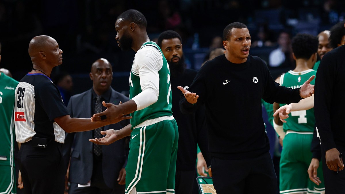 As Boston Celtics guard Jaylen Brown (7) talks with referee Michael Smith (38), head coach Joe Mazzulla gestures towards another official after Brown was called for a charge during the second half against the Philadelphia 76ers at TD Garden