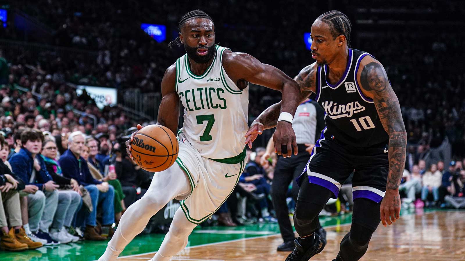 Boston Celtics guard Jaylen Brown (7) drives the ball against Sacramento Kings forward DeMar DeRozan (10) in the second half at TD Garden. 