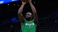 Boston Celtics guard Jaylen Brown (7) warms up before the start of the game against the Detroit Pistons at TD Garden.