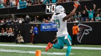 Miami Dolphins wide receiver Jaylen Waddle (17) scores a touchdown against the Atlanta Falcons in the third quarter at Mercedes-Benz Stadium.