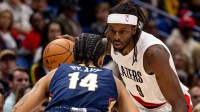 Portland Trail Blazers forward Jerami Grant (9) controls the ball against New Orleans Pelicans guard/forward Micah Peavy (14) during the first half at Smoothie King Center.