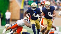 Notre Dame running back Jeremiyah Love (4) runs with the ball on his way to score a touchdown in the first half of a NCAA football game against Syracuse at Notre Dame Stadium on Saturday, Nov. 22, 2025, in South Bend.
