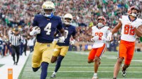 Notre Dame running back Jeremiyah Love (4) runs the ball into the end zone for a touchdown in the first half of a NCAA football game against Syracuse at Notre Dame Stadium on Saturday, Nov. 22, 2025, in South Bend.