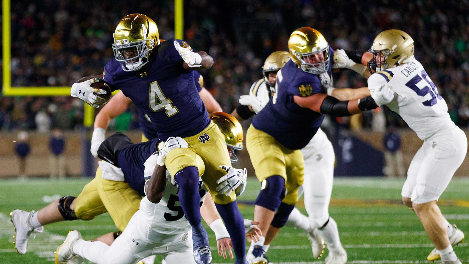 Notre Dame running back Jeremiyah Love (4) runs with the ball during the first half of a NCAA football game against Navy at Notre Dame Stadium on Saturday, Nov. 8, 2025, in South Bend.