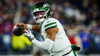 New York Jets quarterback Justin Fields (7) looks to pass the ball against the New England Patriots in the third quarter at Gillette Stadium.