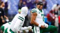 Jets' Justin Fields reacts to his benching with defiant confidence as Aaron Glenn turns to Tyrod Taylor, raising questions about his future.