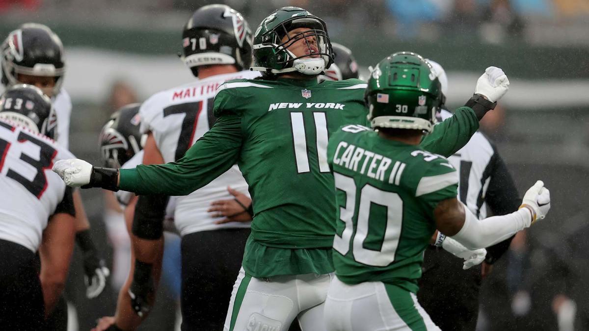 New York Jets linebacker Jermaine Johnson (11) celebrates a sack against the Atlanta Falcons with cornerback Michael Carter II (30) during the first quarter at MetLife Stadium.