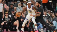 Golden State Warriors forward Jimmy Butler III (10) dribbles against San Antonio Spurs forward Julian Champagnie (30) in the first half at Frost Bank Center.