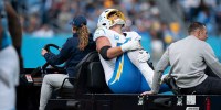 Los Angeles offensive tackle Joe Alt (76) is carted off the field after an apparent leg injury during their game against the Tennessee Titans at Nissan Stadium in Nashville, Tenn., Sunday, Nov. 2, 2025.