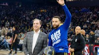 Golden State Warriors CEO Joe Lacob presents guard Stephen Curry (30) with the 2024 NBA All-Star ball before the game against the Phoenix Suns at Chase Center.