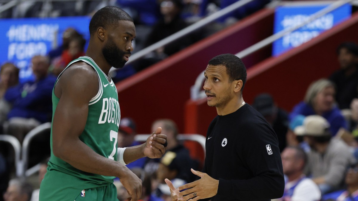 Boston Celtics head coach Joe Mazzulla talks to guard Jaylen Brown (7) in the second half against the Detroit Pistons at Little Caesars Arena.