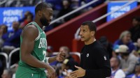Boston Celtics head coach Joe Mazzulla talks to guard Jaylen Brown (7) in the second half against the Detroit Pistons at Little Caesars Arena.