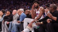 Philadelphia 76ers center Joel Embiid (21) tends to his knee while sitting on the bench during the fourth quarter of game 5 of the first round of the 2024 NBA playoffs against the New York Knicks at Madison Square Garden.