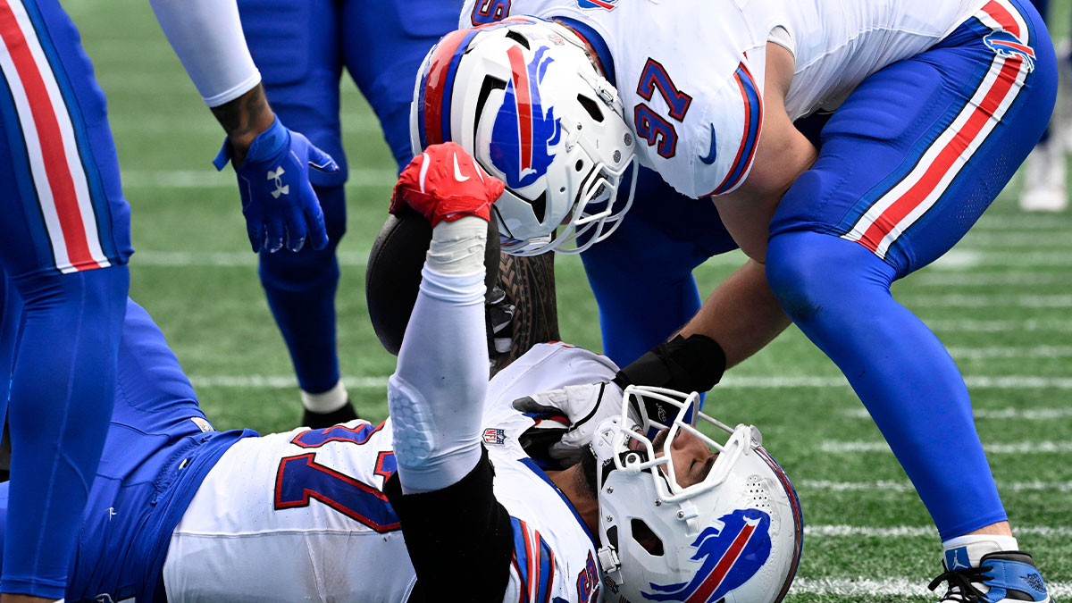 Buffalo Bills defensive end AJ Epenesa (57) celebrates with defensive end Joey Bosa (97) after intercepting a pass in the second quarter against the Carolina Panthers at Bank of America Stadium.