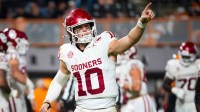 Oklahoma quarterback John Mateer (10) points toward the Oklahoma section after a fourth quarter touchdown during a college football game between Tennessee and Oklahoma in Neyland Stadium in Knoxville on Nov. 1, 2025.