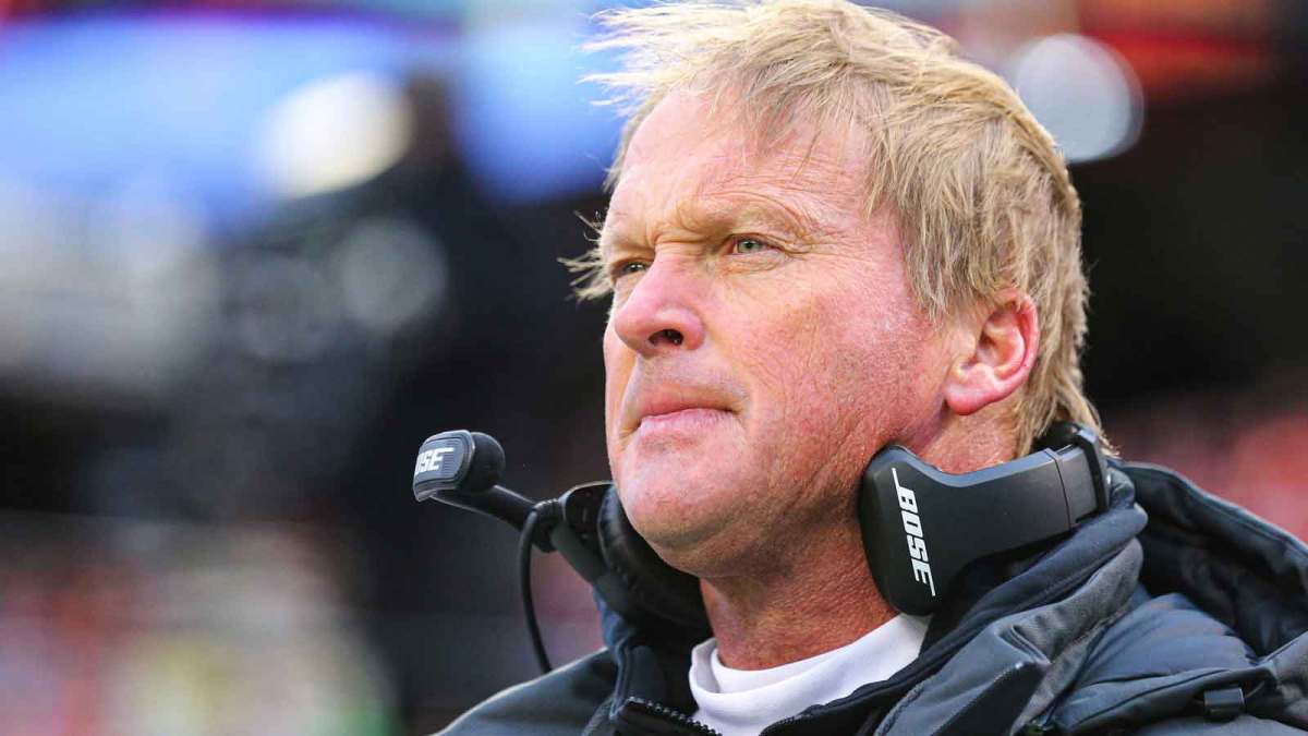 Oakland Raiders head coach Jon Gruden observes the national anthem before the game against the Kansas City Chiefs at Arrowhead Stadium.