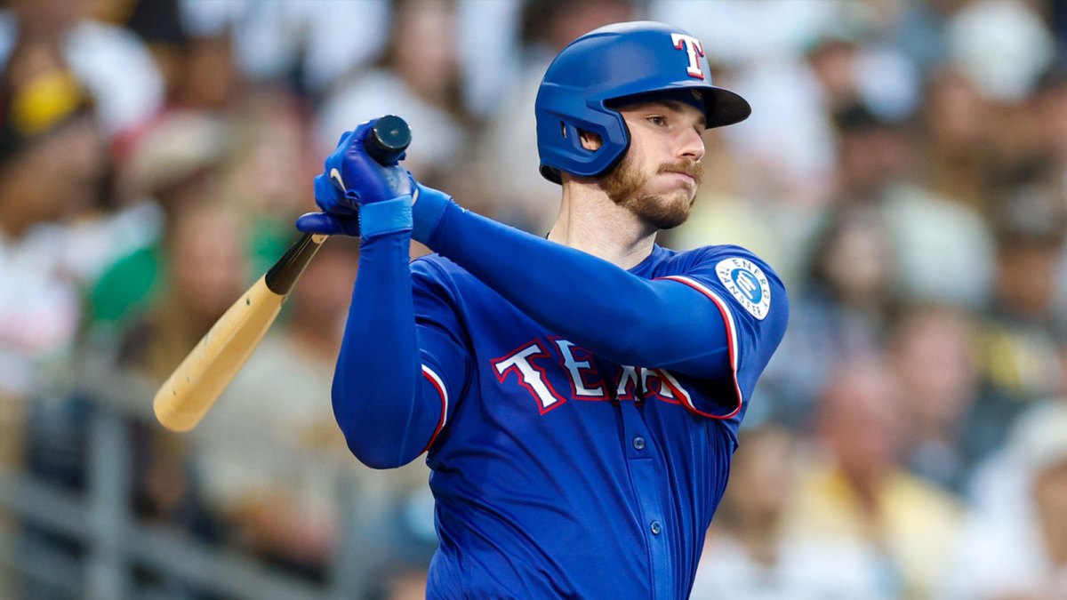 Texas Rangers designated hitter Jonah Heim (28) hits a RBI double during the fourth inning against the San Diego Padres at Petco Park.