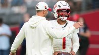 Arizona Cardinals quarterback Kyler Murray (1) and head coach Jonathan Gannon talk before the game against the Seattle Seahawks at State Farm Stadium.