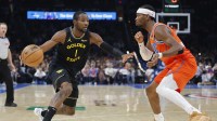 Golden State Warriors forward Jonathan Kuminga (1) moves the ball down the court beside Oklahoma City Thunder guard Shai Gilgeous-Alexander (2) during the second half at Paycom Center.