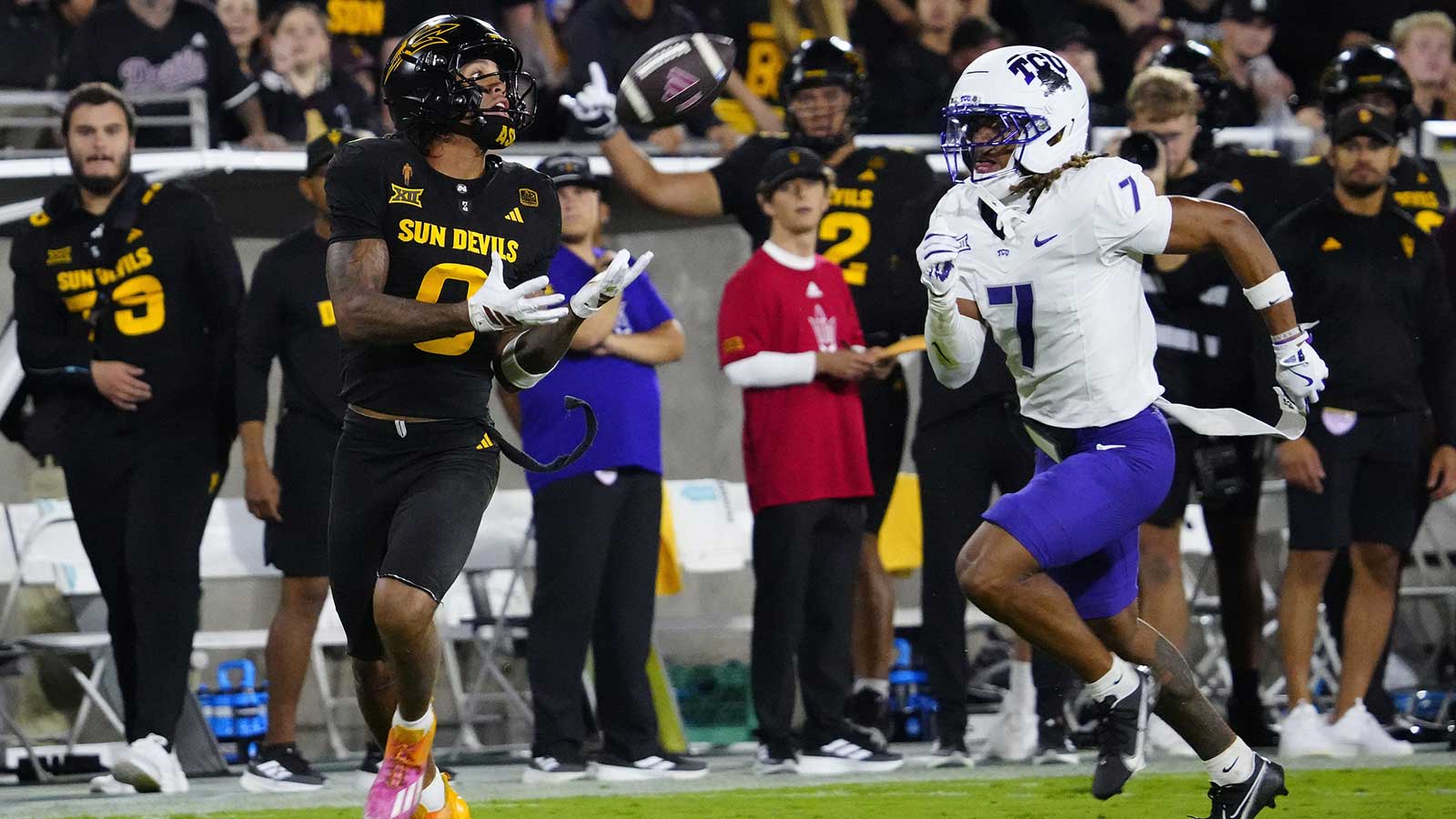 Arizona State wide receiver Jordyn Tyson (0) catches a pass against TCU defensive back Channing Canada (7) on his way to a touchdown during a game at Mountain America Stadium in Tempe, Ariz. on Sept. 26, 2025.