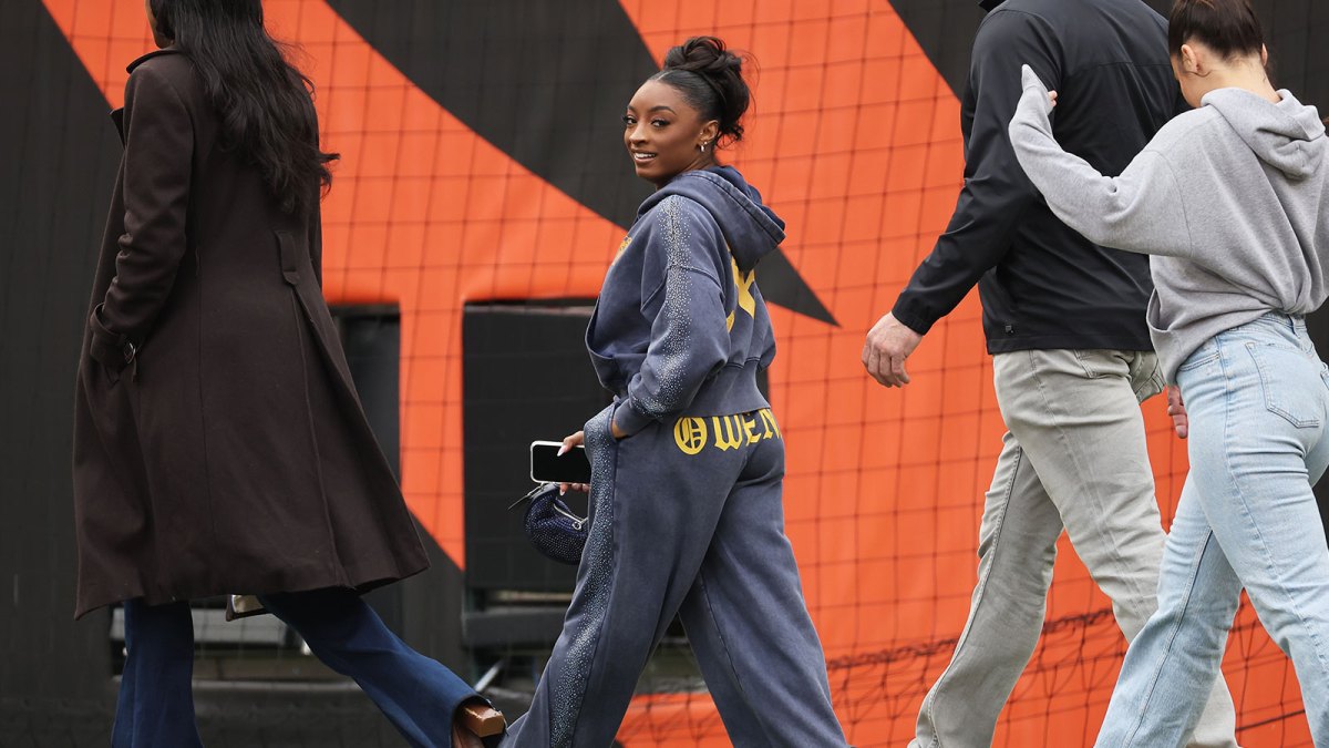 Nov 2, 2025; Cincinnati, Ohio, USA; American gymnast Simone Biles walks on the field before the game between the Chicago Bears and the Cincinnati Bengals at Paycor Stadium. Mandatory Credit: Joseph Maiorana-Imagn Images