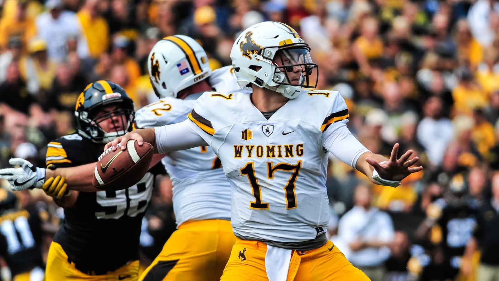 Wyoming Cowboys quarterback Josh Allen (17) throws a pass during the game between the Iowa Hawkeyes and the Wyoming Cowboys at Kinnick Stadium. 