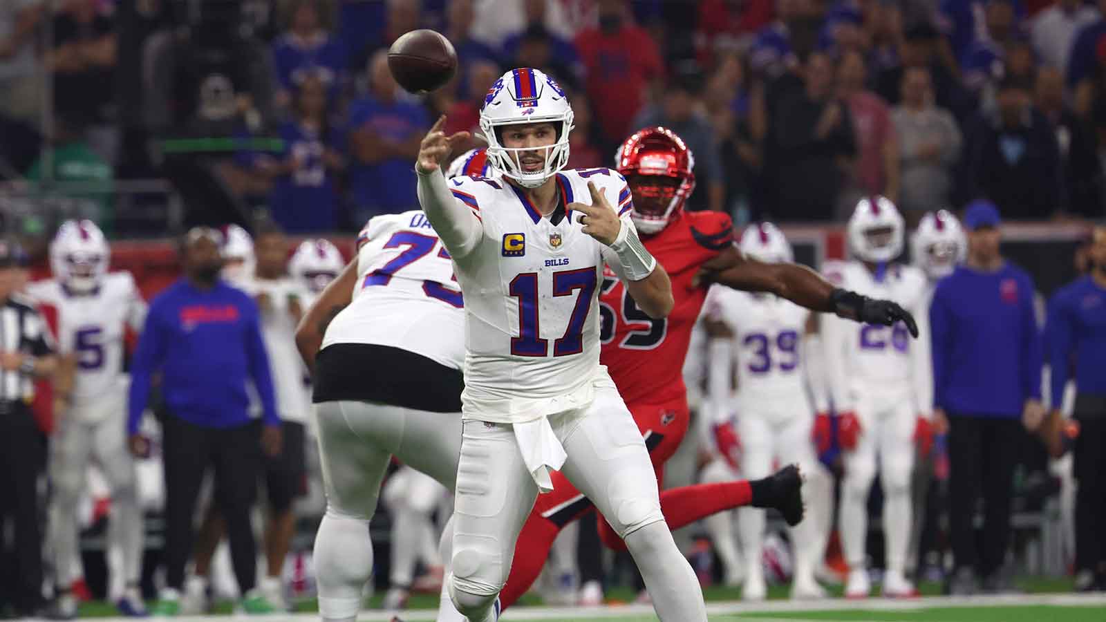 Bills QB Josh Allen writhes in pain, kicking ground after huge hit by Texans