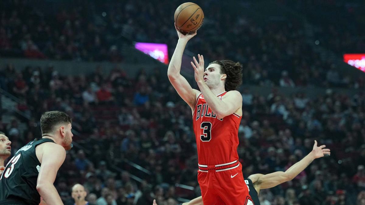 Chicago Bulls guard Josh Giddey (3) shoots over Portland Trail Blazers center Donovan Clingan (23) during the first half at Moda Center.