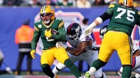 Green Bay Packers running back Josh Jacobs (8) runs the ball against New York Giants defensive tackle Roy Robertson-Harris (95) during the first quarter at MetLife Stadium.