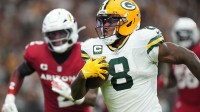 Green Bay Packers running back Josh Jacobs (8) runs in for a touchdown against the Arizona Cardinals at State Farm Stadium.