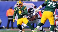 Green Bay Packers running back Josh Jacobs (8) runs the ball against New York Giants defensive tackle Roy Robertson-Harris (95) during the first quarter at MetLife Stadium.