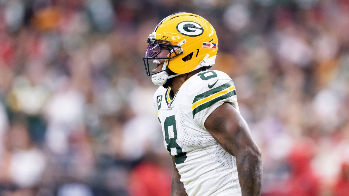Green Bay Packers running back Josh Jacobs (8) celebrates against the Arizona Cardinals in the second half at State Farm Stadium.