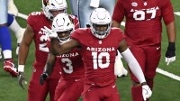 Arizona Cardinals linebacker Josh Sweat (10) celebrates after a sack against Dallas Cowboys quarterback Dak Prescott (4) in the first half at AT&T Stadium.